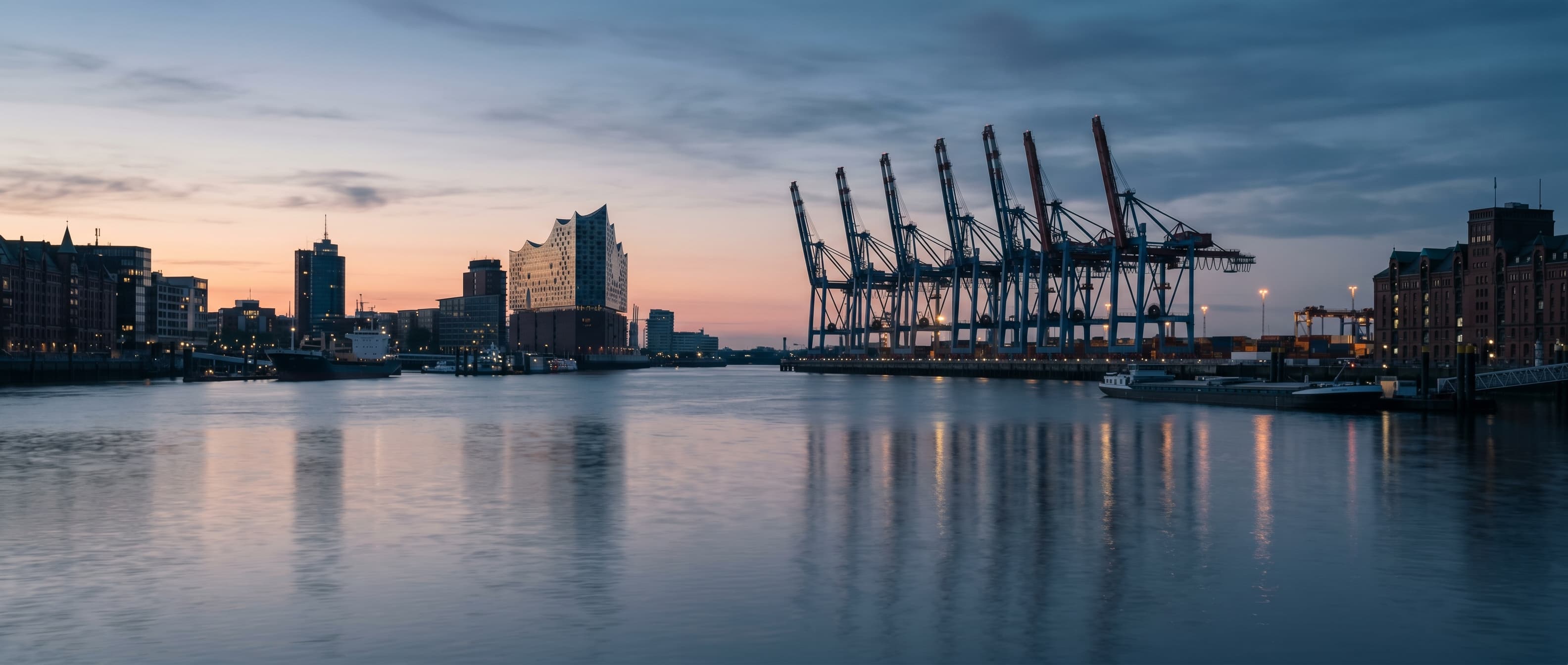 Port of Hamburg at blue hour – Elbphilharmonie and container cranes