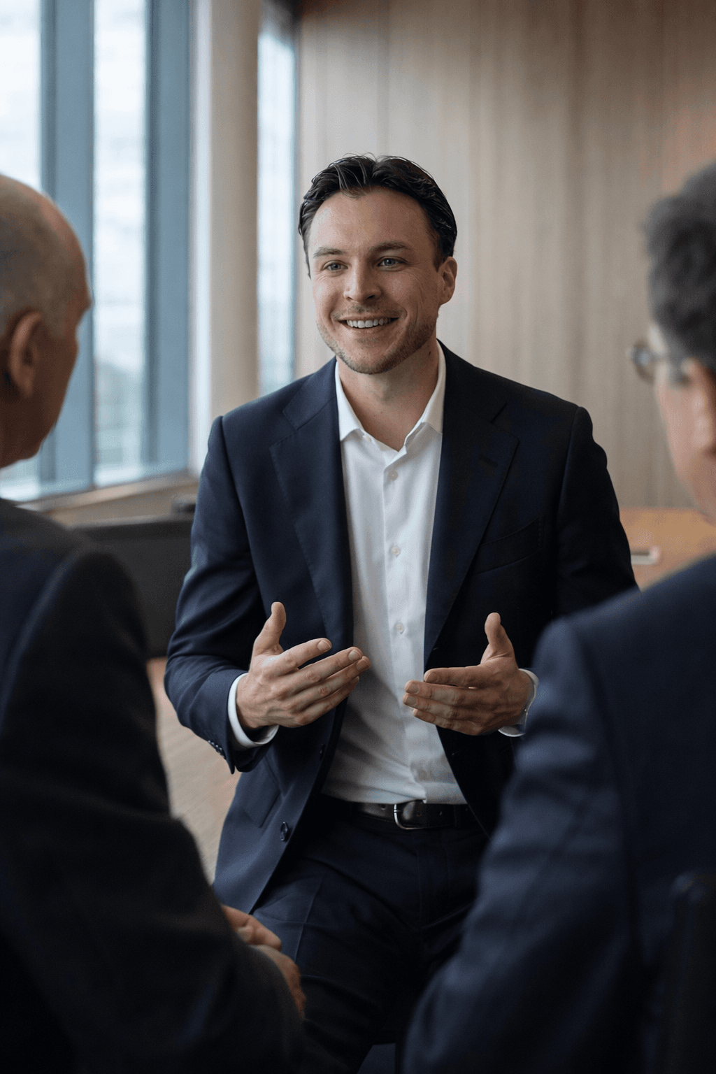 Professional business meeting — trusted exchange among decision-makers